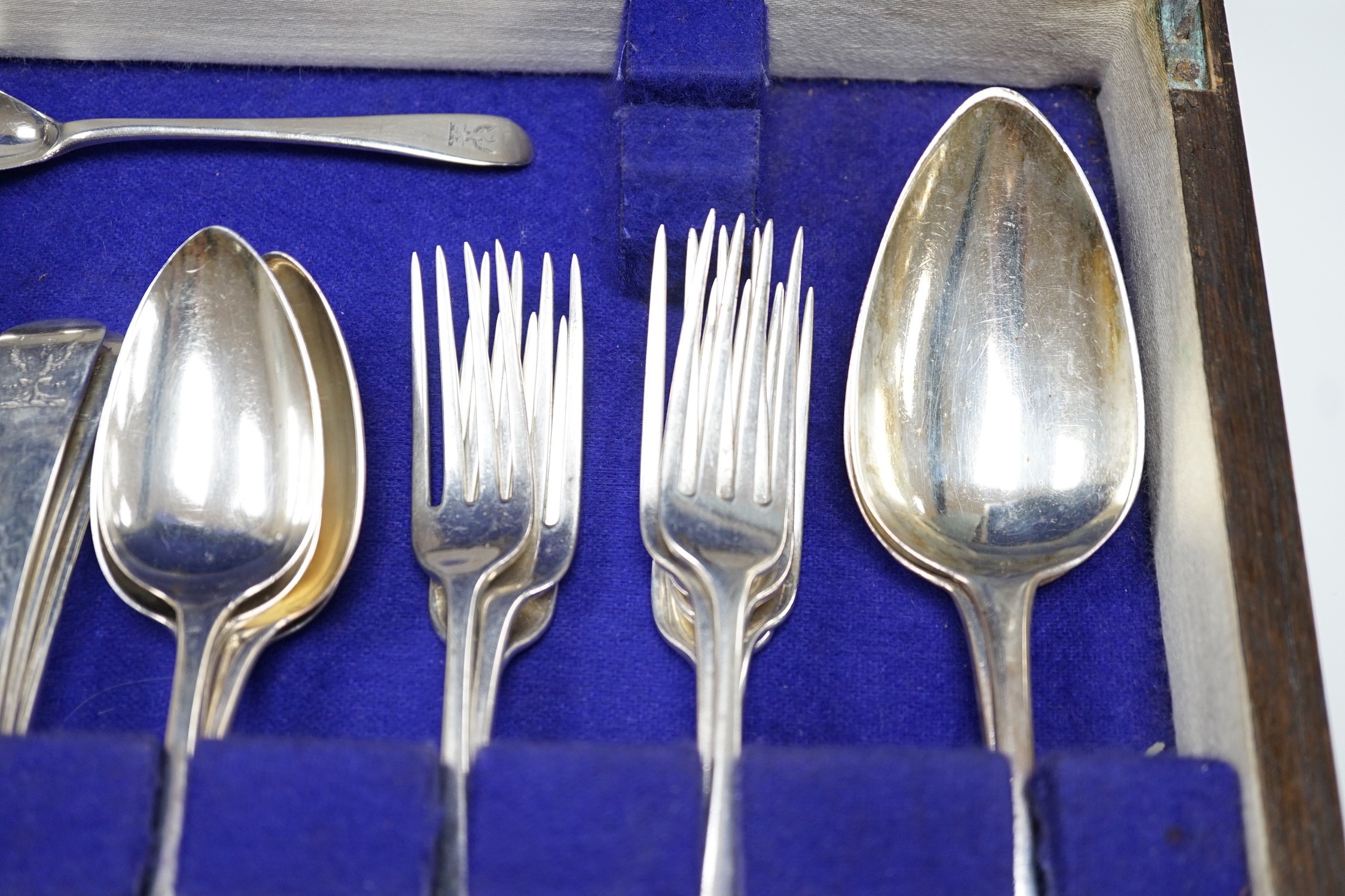 A part canteen of 19th century silver flatware, various dates, patterns and makers, including a set of eight George III silver dessert forks, Thomas Wallis II, London, 1806 and a set of eight dessert spoons, Richard Cros